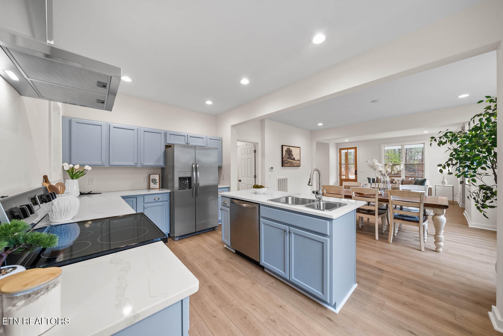 1023 West Laurel Way Monterey, TN 38574 - Photo 8 of 60 a large kitchen with kitchen island a sink table and chairs