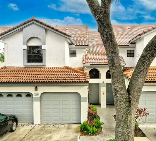 a front view of a house with a garage