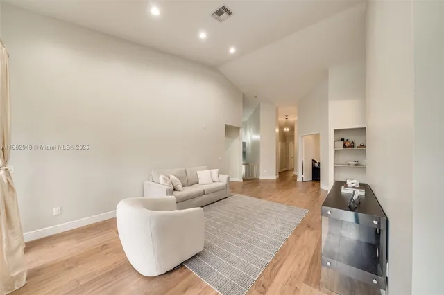 a kitchen with a stove a sink and a refrigerator