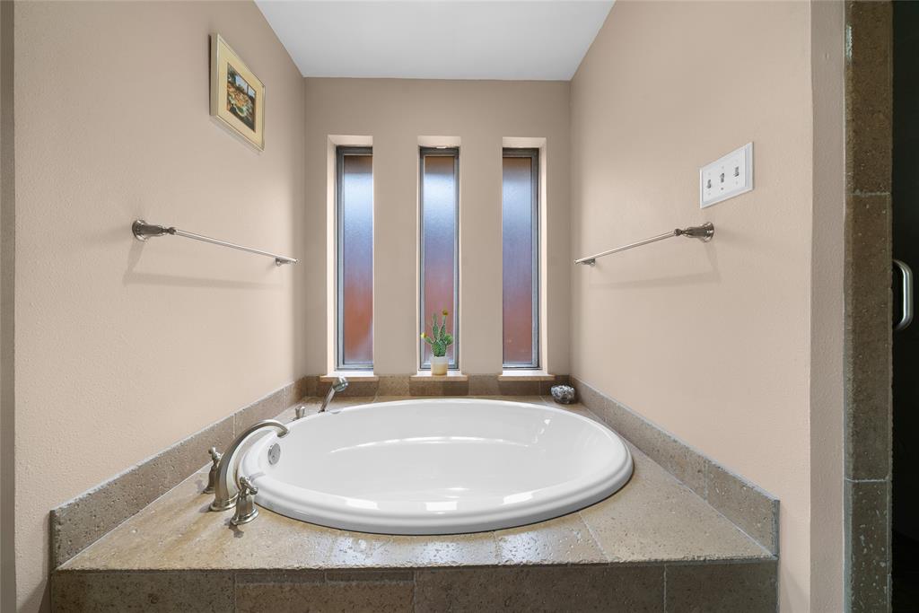 9727 Amberley Drive Dallas, TX 75243 - Photo 11 of 19 a bathroom with a sink and a mirror