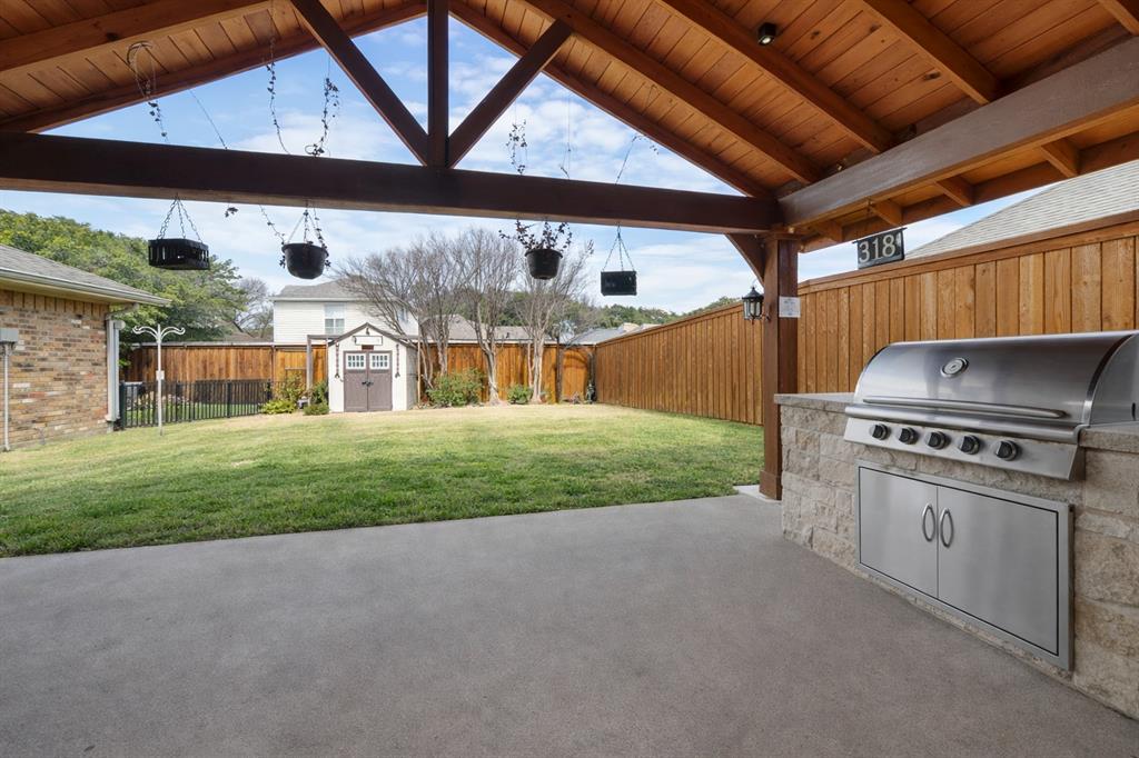 9727 Amberley Drive Dallas, TX 75243 - Photo 17 of 19 a view of a backyard with dishwasher and stove
