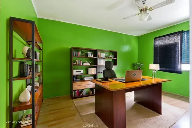 a room with furniture and fan