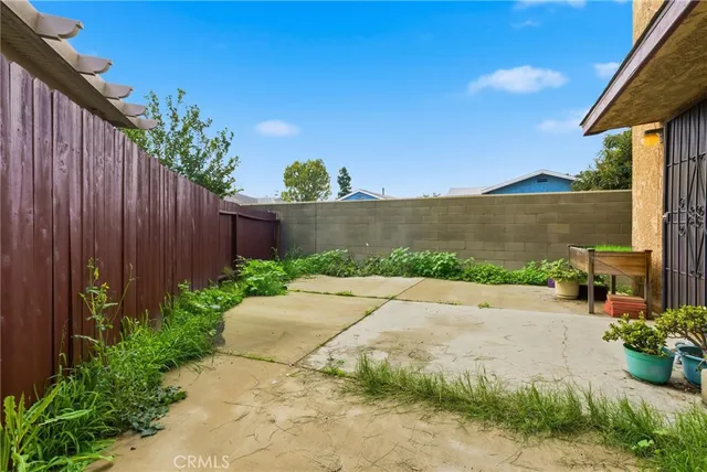 a kitchen with a refrigerator and a stove