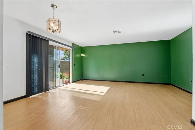 a view of an empty room with a fireplace