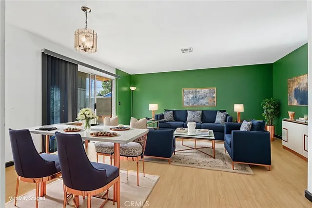a living room with fireplace furniture and a flat screen tv