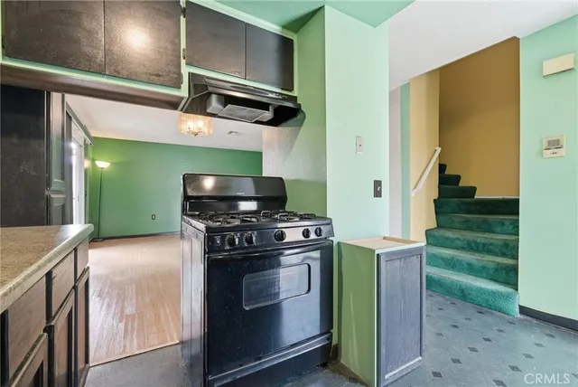 a kitchen with a stove and a microwave