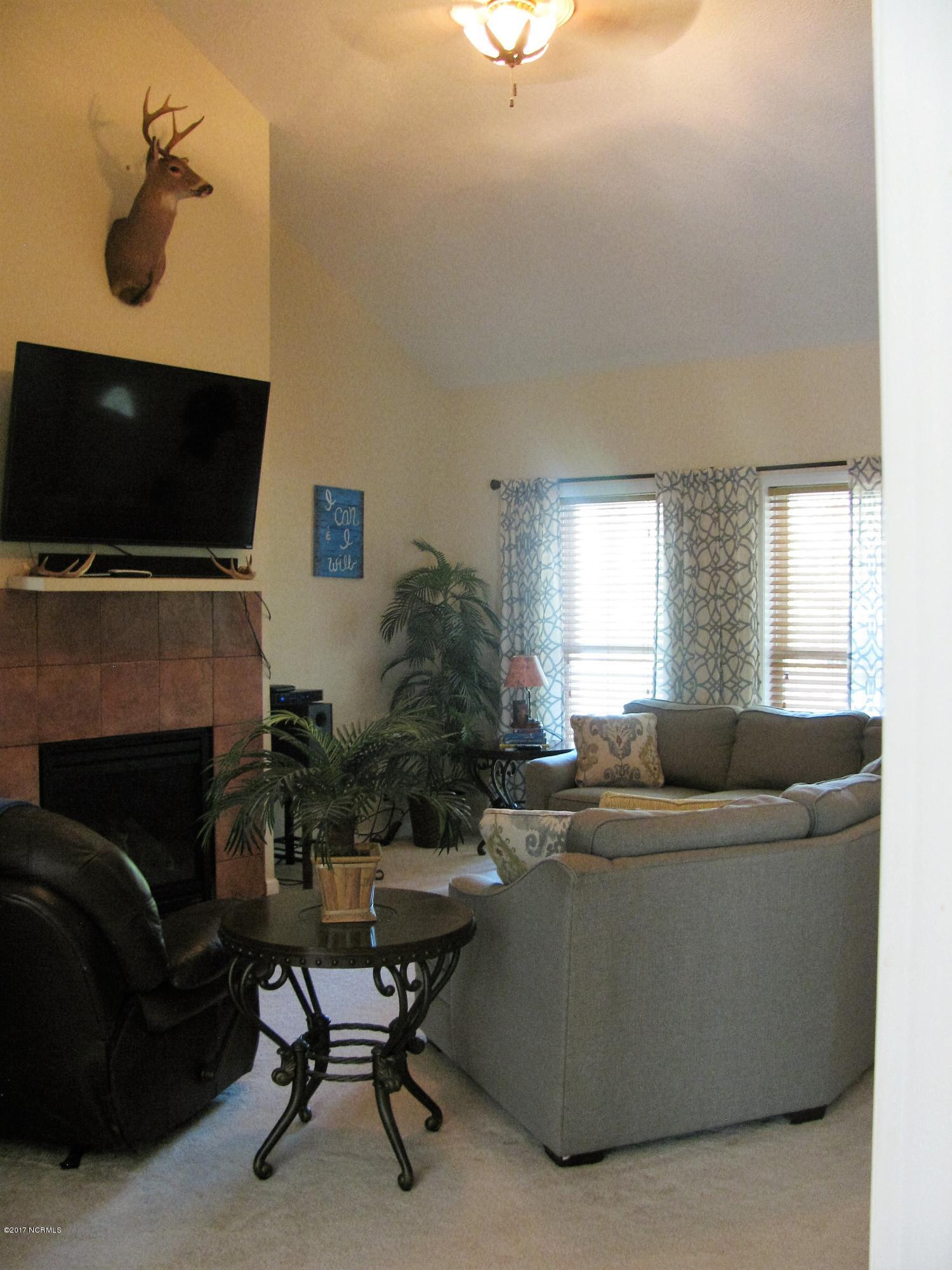300 Riverside Drive Varnamtown, NC 28462 - Photo 10 of 16 Cathedral Ceilings in Living Room