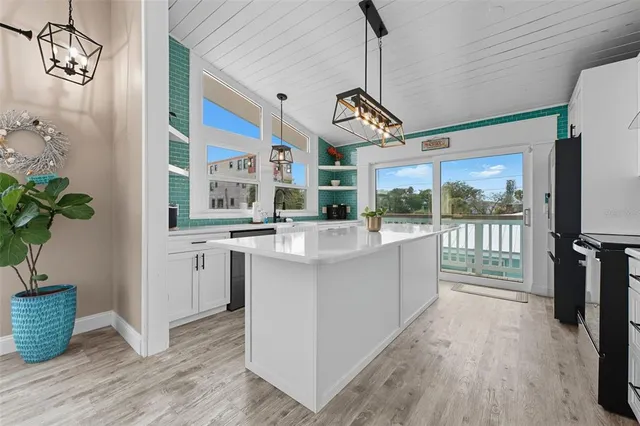 a view of kitchen with furniture and large window