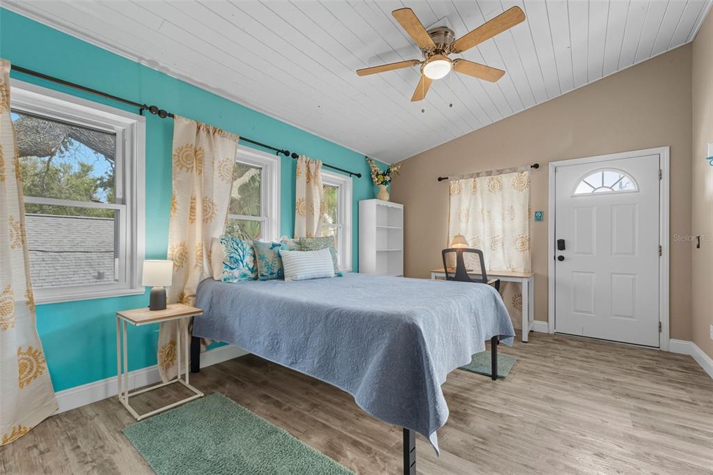 208 Bates Avenue Indian Rocks Beach, FL 33785 - Photo 22 of 47 a bed room with a bed and a window