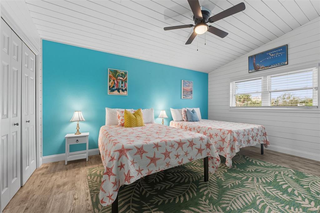 208 Bates Avenue Indian Rocks Beach, FL 33785 - Photo 24 of 47 a bedroom with a bed and a window