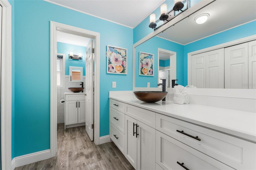208 Bates Avenue Indian Rocks Beach, FL 33785 - Photo 26 of 47 a kitchen with stainless steel appliances white cabinets and window