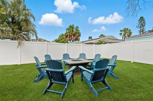 a patio with table and chairs