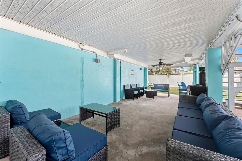 208 Bates Avenue Indian Rocks Beach, FL 33785 - Photo 33 of 47 a living room with furniture and a large window
