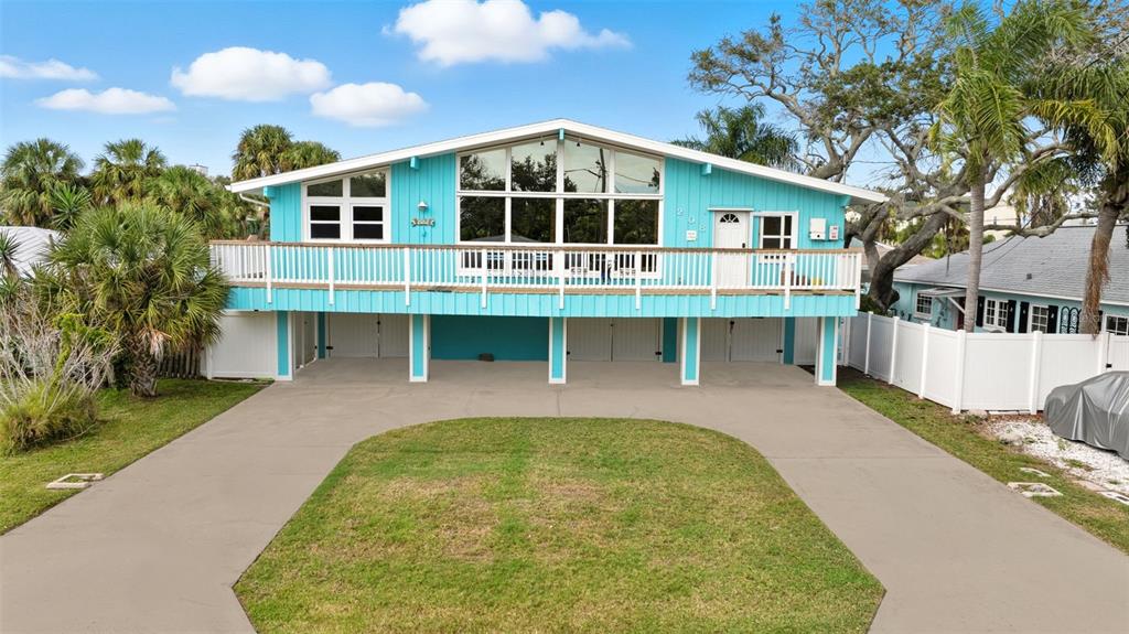 208 Bates Avenue Indian Rocks Beach, FL 33785 - Photo 40 of 47 a front view of a house with a yard