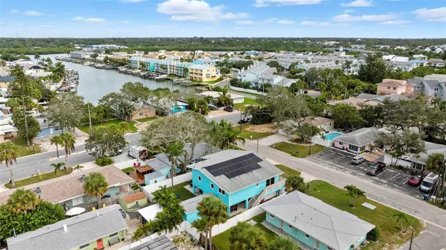 an aerial view of residential houses with outdoor space