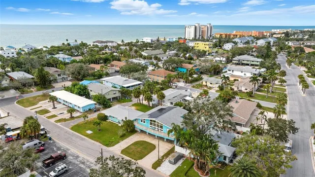 an aerial view of residential houses with outdoor space