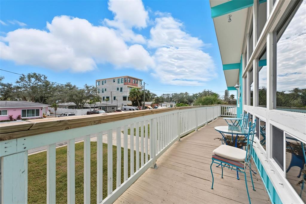 208 Bates Avenue Indian Rocks Beach, FL 33785 - Photo 6 of 47 a view of a balcony with chairs
