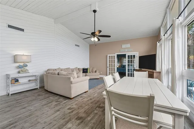a living room with furniture fireplace and a flat screen tv