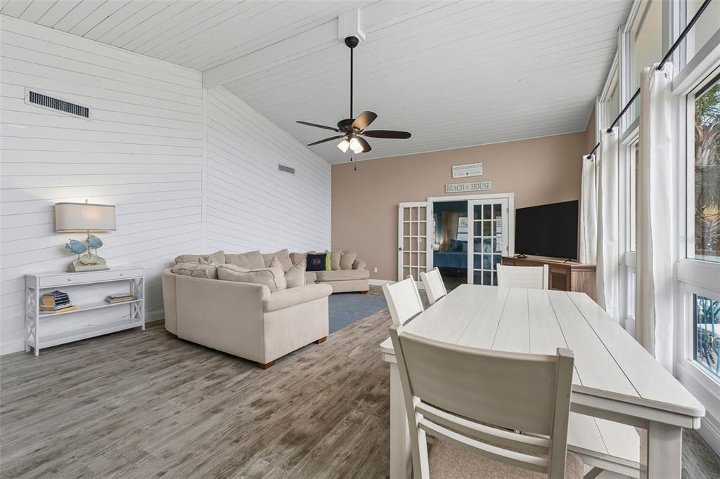 208 Bates Avenue Indian Rocks Beach, FL 33785 - Photo 8 of 47 a living room with furniture fireplace and a flat screen tv