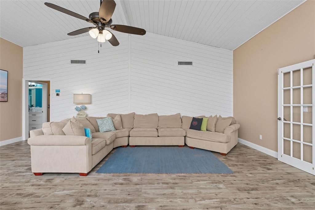 208 Bates Avenue Indian Rocks Beach, FL 33785 - Photo 9 of 47 a living room with furniture and a rug