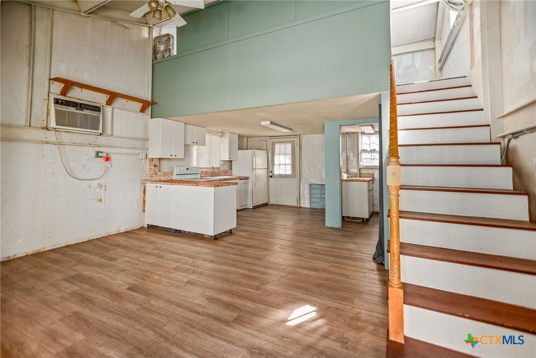 303 Garcitas Grove Road Inez, TX 77968 - Photo 29 of 39 a view of a kitchen with wooden floor and electronic appliances