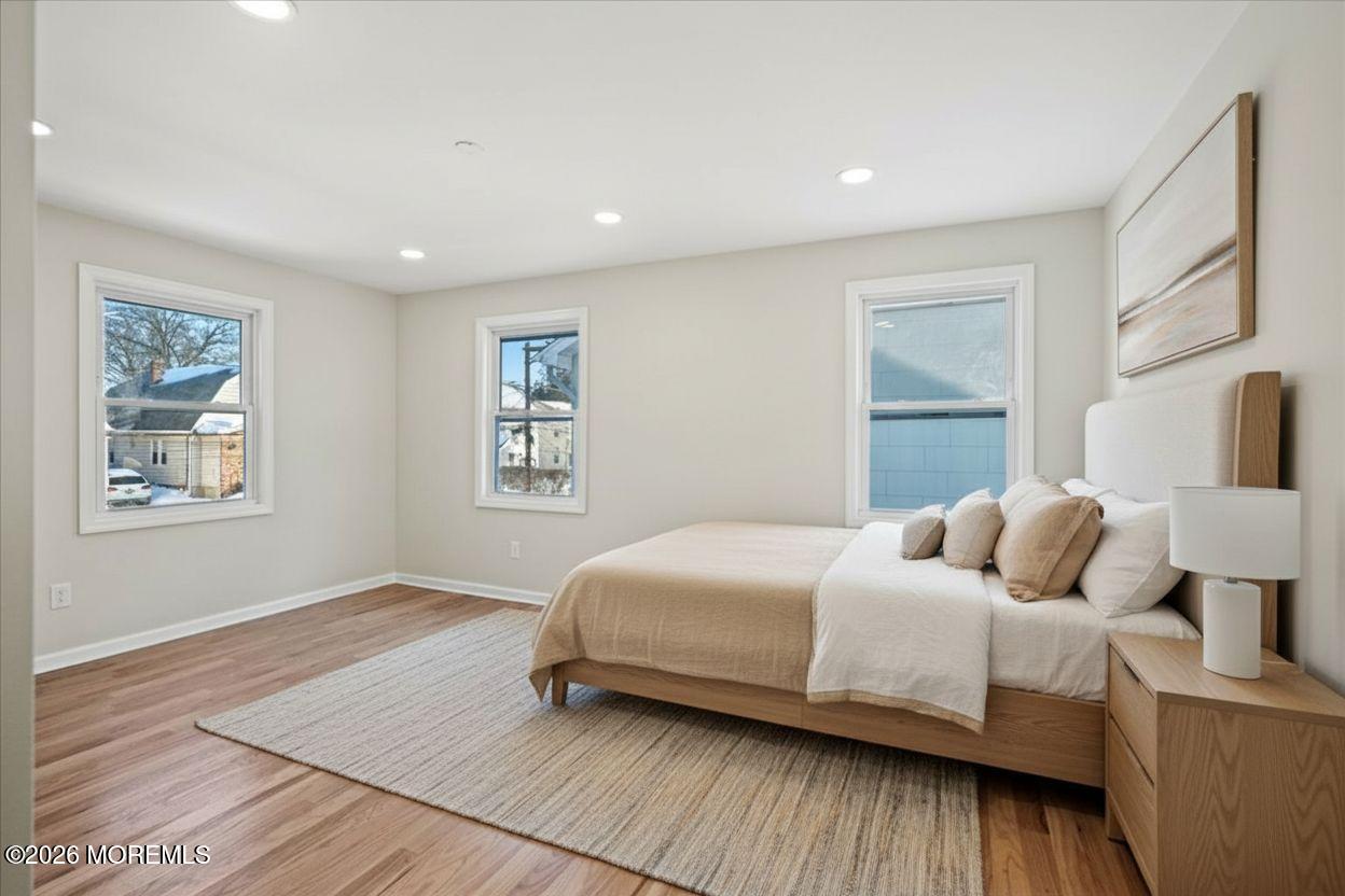 20 Elston Street Bloomfield, NJ 07003 - Photo 19 of 43 a bedroom with a bed and wooden floor