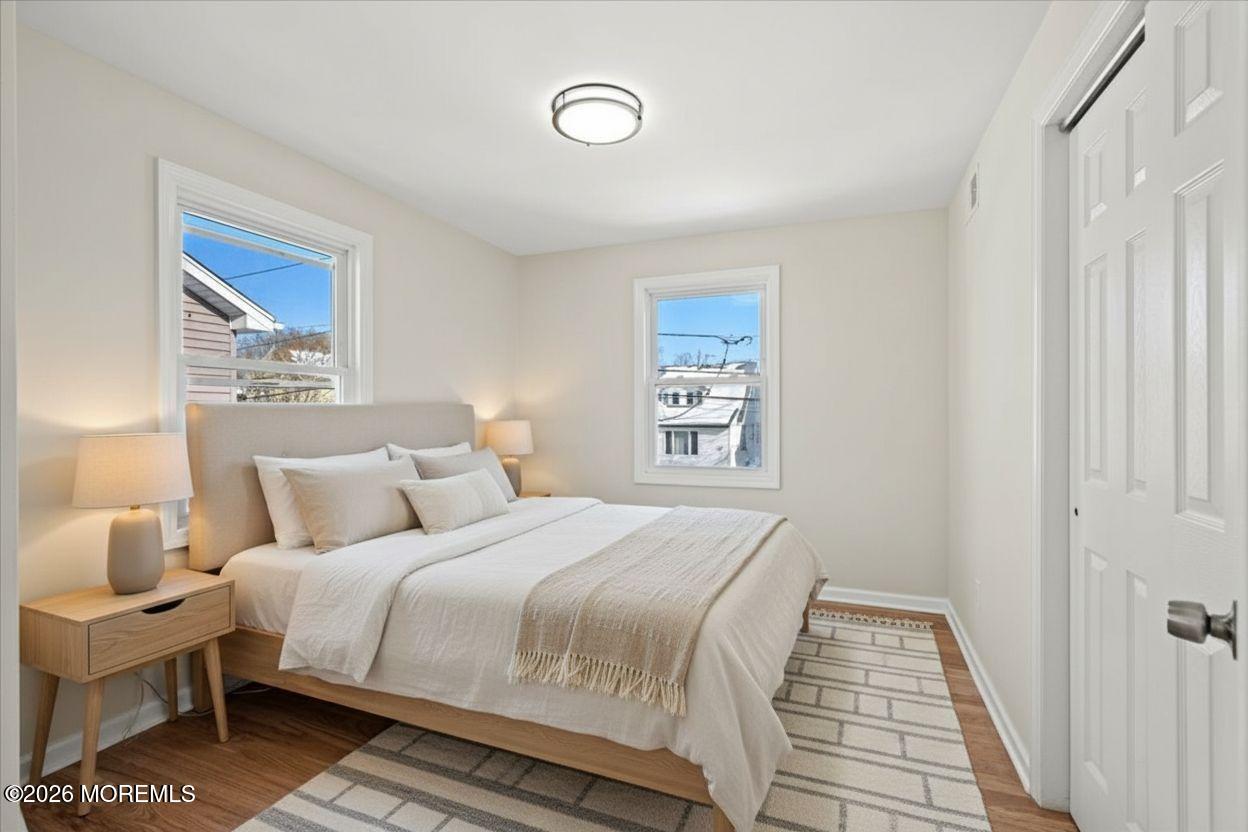 20 Elston Street Bloomfield, NJ 07003 - Photo 35 of 43 a bedroom with a bed and a window