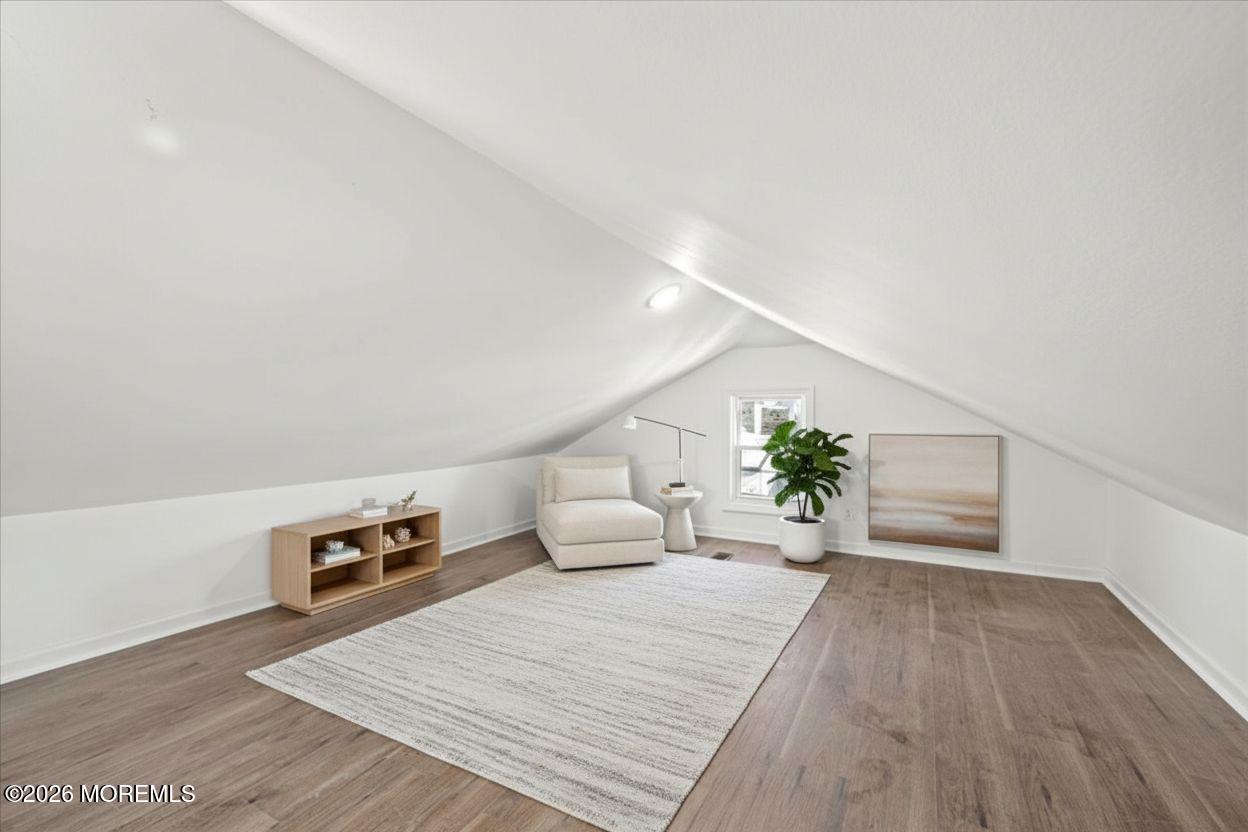 20 Elston Street Bloomfield, NJ 07003 - Photo 37 of 43 a hallway with a potted plant and wooden floor