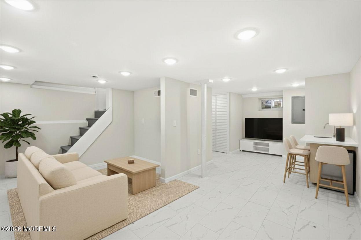 20 Elston Street Bloomfield, NJ 07003 - Photo 39 of 43 a living room with furniture and a flat screen tv