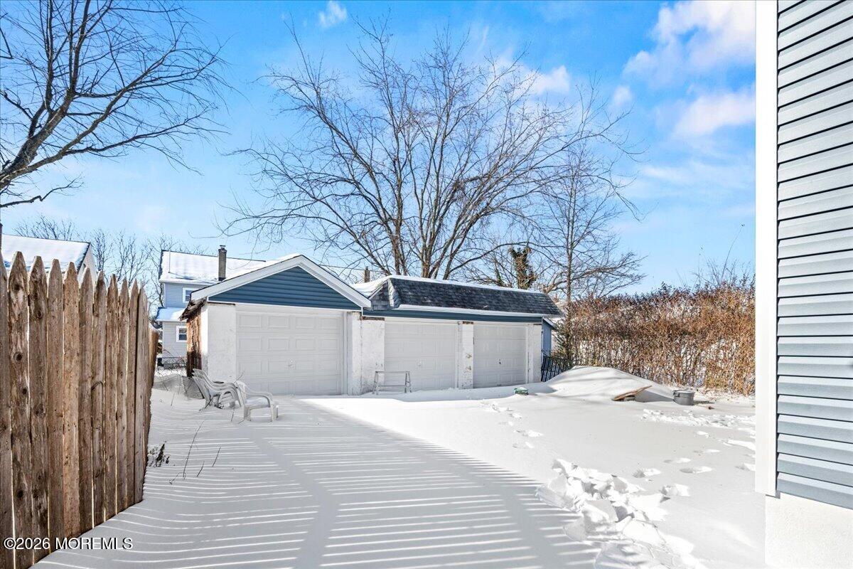 20 Elston Street Bloomfield, NJ 07003 - Photo 43 of 43 a view of a house with a yard covered in snow