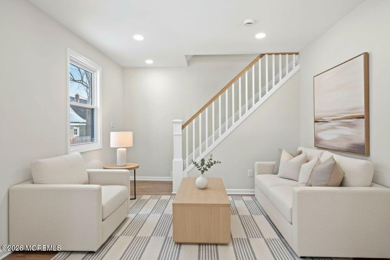 20 Elston Street Bloomfield, NJ 07003 - Photo 8 of 43 a living room with furniture and a table