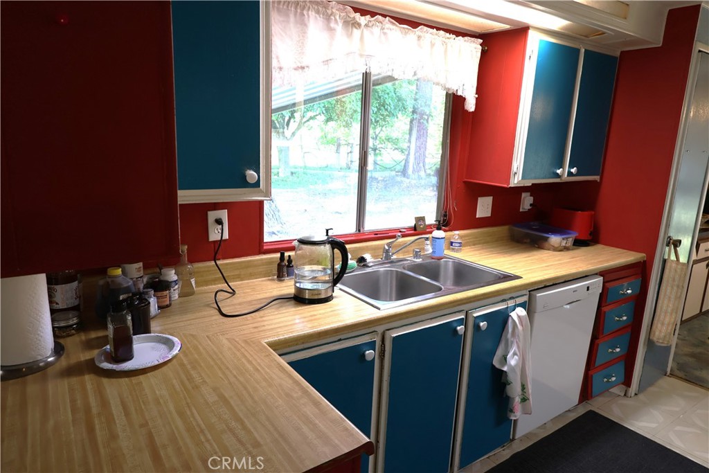 22189 Samson Avenue Corning, CA 96021 - Photo 12 of 59 a kitchen with sink and large window