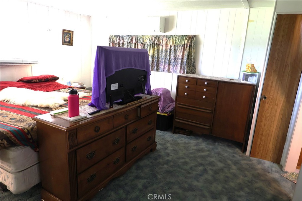 22189 Samson Avenue Corning, CA 96021 - Photo 19 of 59 a room with a dresser with a mirror