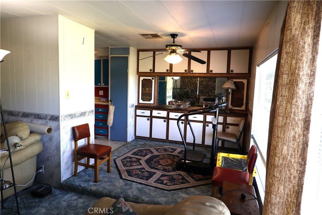 22189 Samson Avenue Corning, CA 96021 - Photo 2 of 59 a living room with furniture and floor to ceiling windows