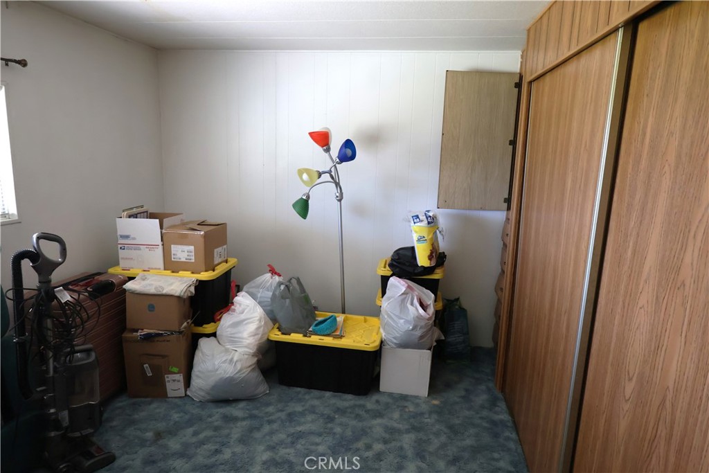 22189 Samson Avenue Corning, CA 96021 - Photo 21 of 59 a living room with furniture and a window