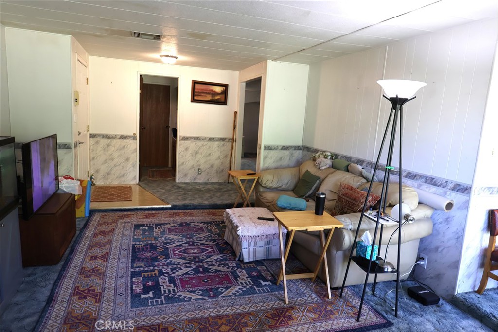 22189 Samson Avenue Corning, CA 96021 - Photo 4 of 59 a living room with furniture and a rug