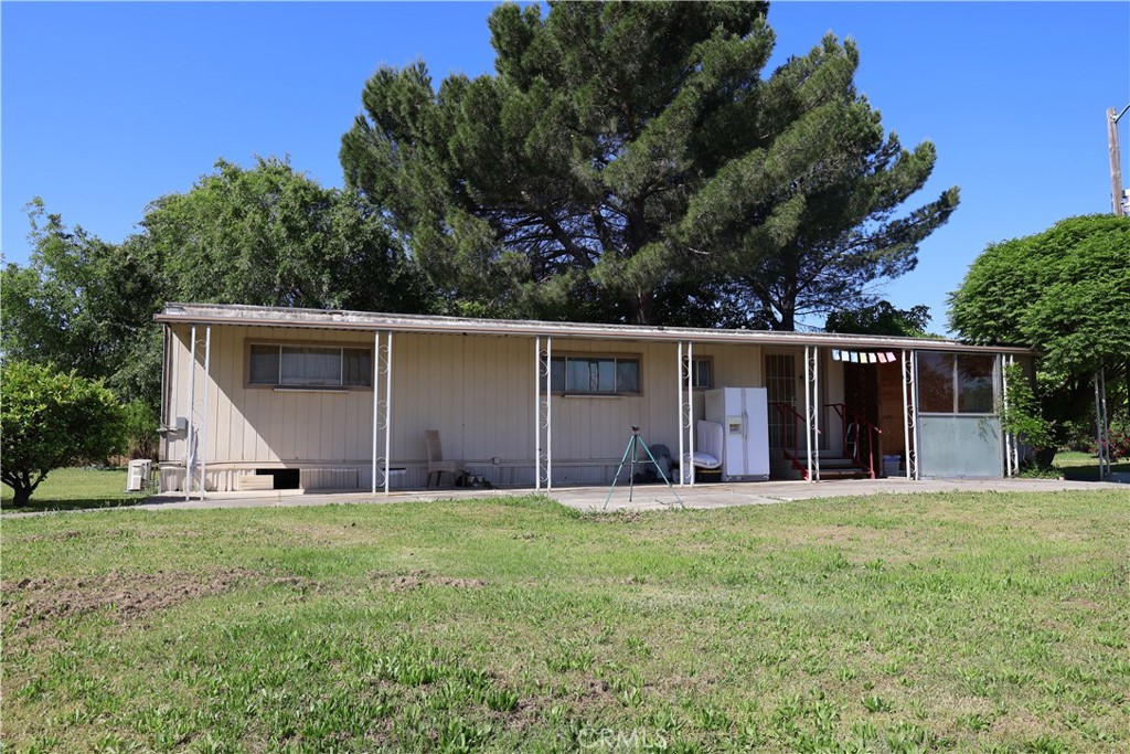 22189 Samson Avenue Corning, CA 96021 - Photo 41 of 59 front view of a house with a yard