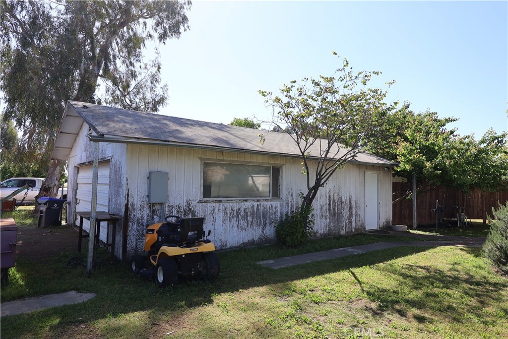 22189 Samson Avenue Corning, CA 96021 - Photo 42 of 59 a backyard of a house with barbeque oven table and chairs