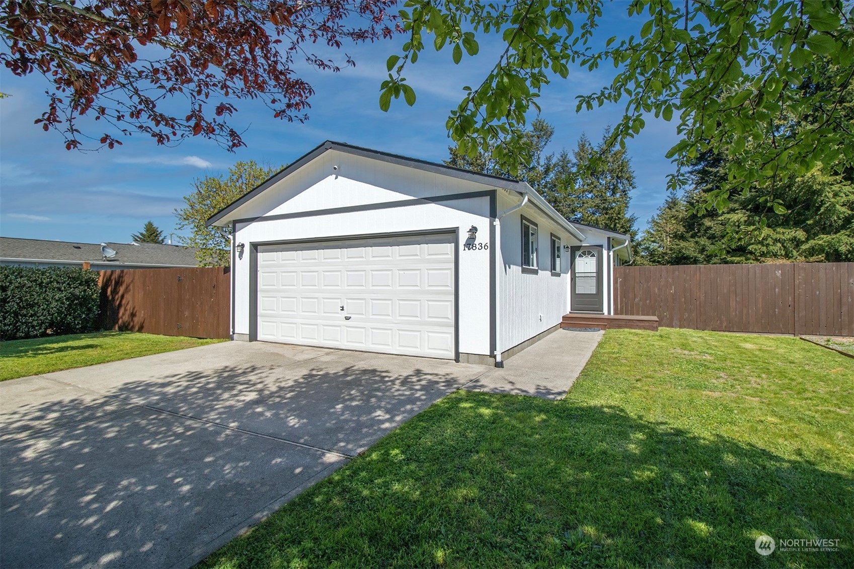 17836 Camus Drive Southwest Rochester, WA 98579 - Photo 1 of 27 a house with green field in front of it