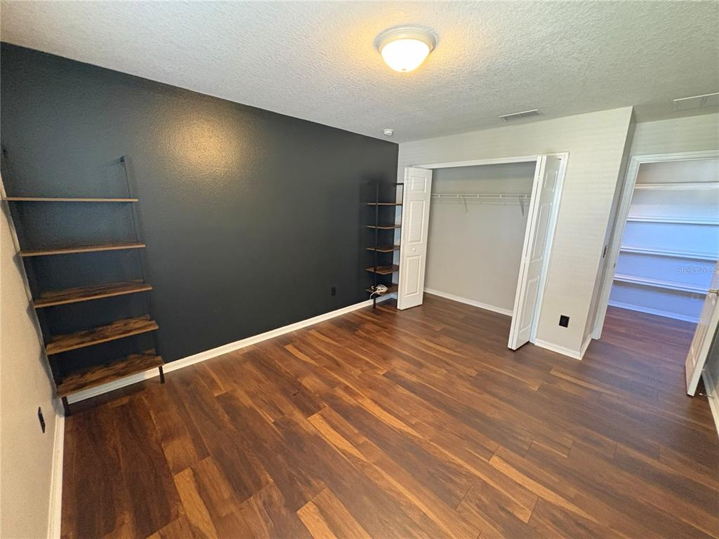 1431 Spring Fest Lane Orlando, FL 32828 - Photo 16 of 36 a view of empty room with wooden floor