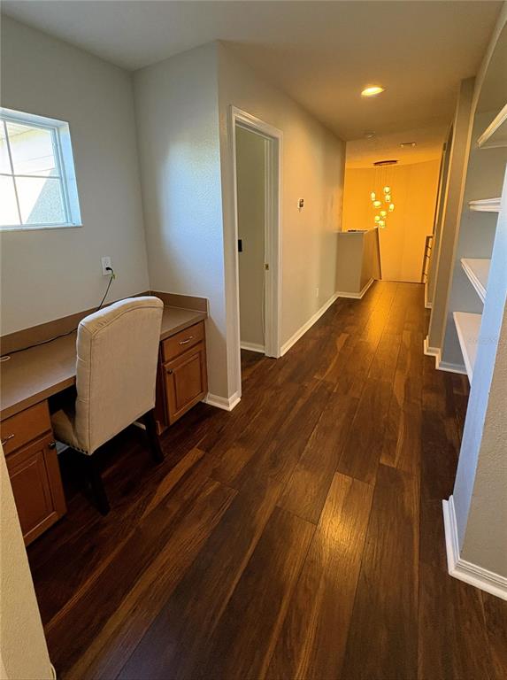 1431 Spring Fest Lane Orlando, FL 32828 - Photo 21 of 36 a room with wooden floor and a view of bathroom