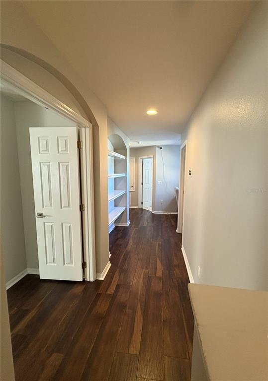 1431 Spring Fest Lane Orlando, FL 32828 - Photo 22 of 36 a view of a hallway with wooden floor