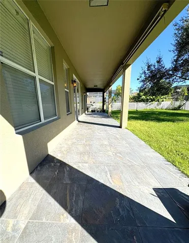a view of an empty room with a yard
