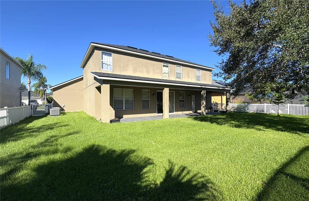 1431 Spring Fest Lane Orlando, FL 32828 - Photo 29 of 36 a view of a house with backyard