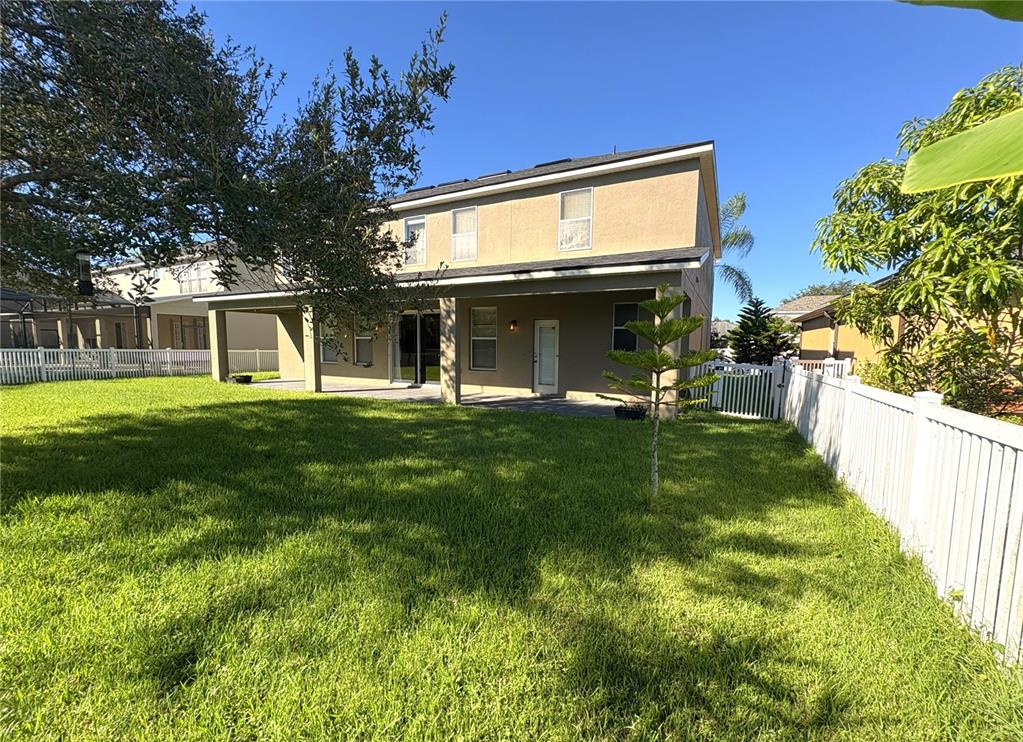 1431 Spring Fest Lane Orlando, FL 32828 - Photo 31 of 36 a view of a house with a yard and sitting area
