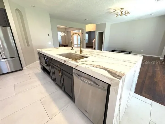 a bathroom with a sink vanity and mirror