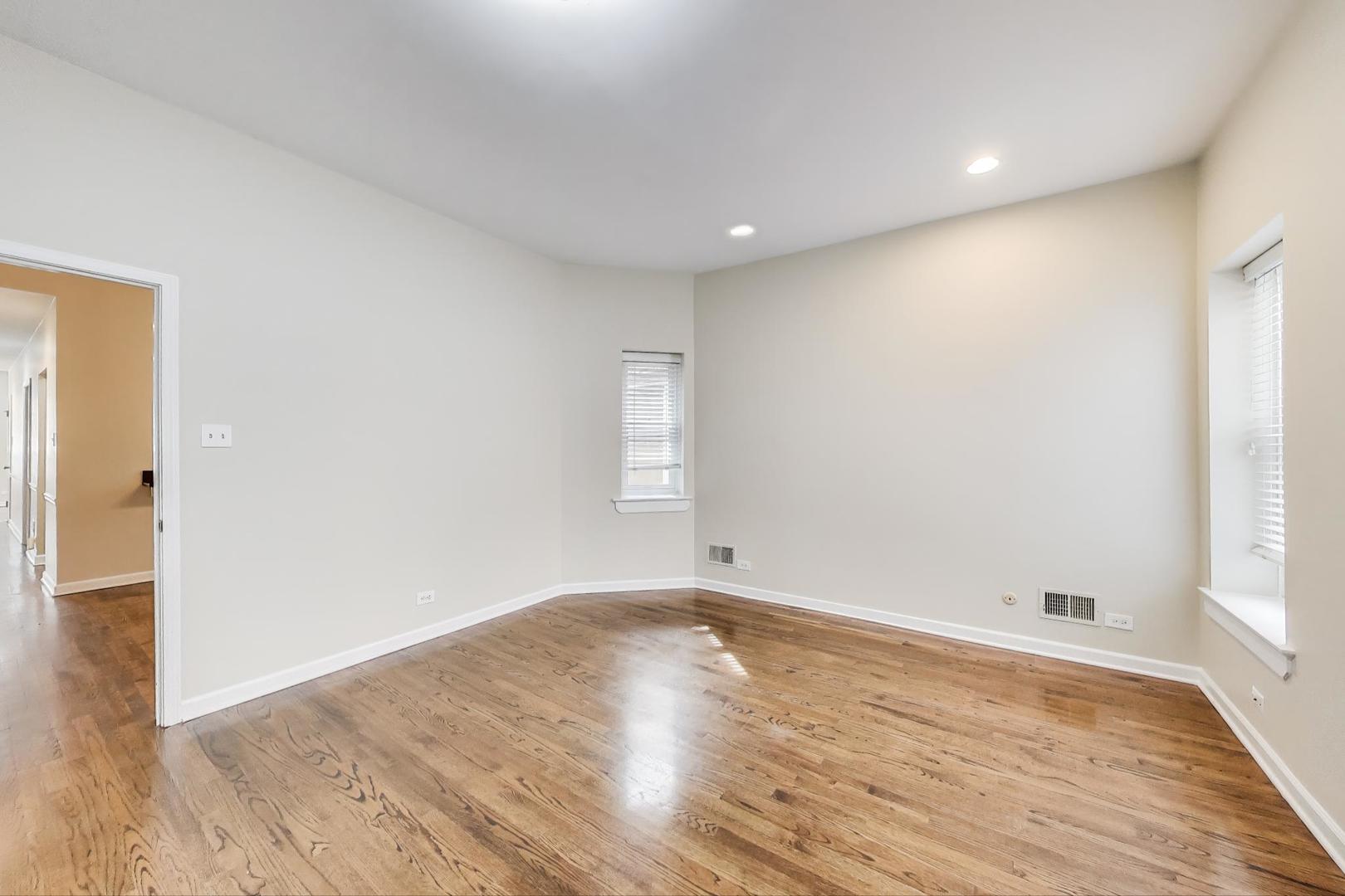 636 West Grace Street, Unit 2W Chicago, IL 60613 - Photo 15 of 26 a view of room with window and wooden floor