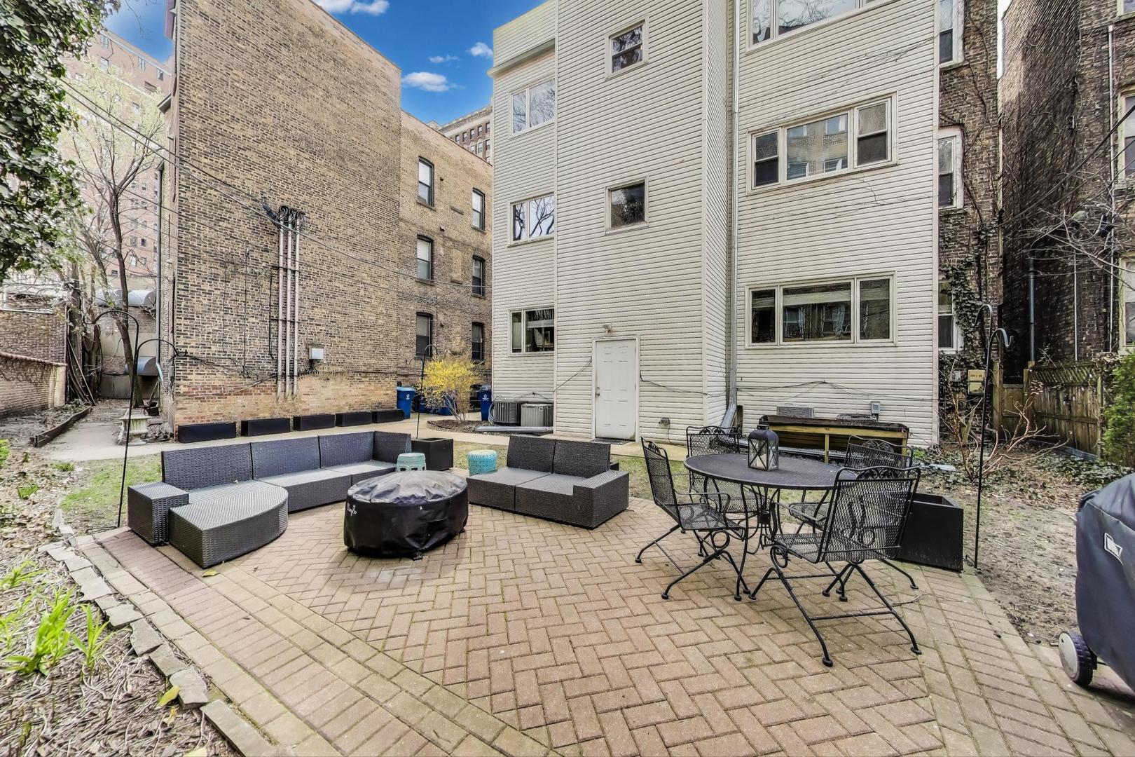 636 West Grace Street, Unit 2W Chicago, IL 60613 - Photo 22 of 26 a building outdoor space with patio furniture