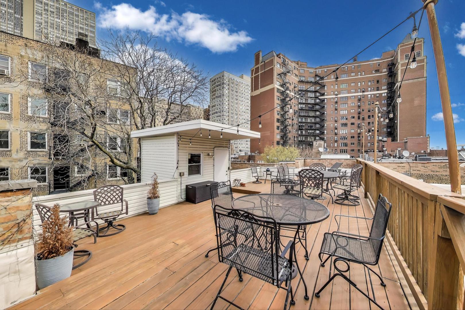 636 West Grace Street, Unit 2W Chicago, IL 60613 - Photo 25 of 26 a view of a patio with couches table and chairs