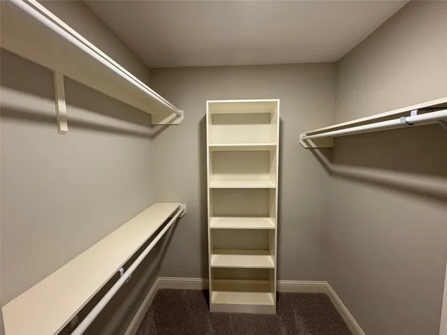 a view of room with wooden floor